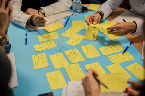 Sticky notes on a table during a workshop