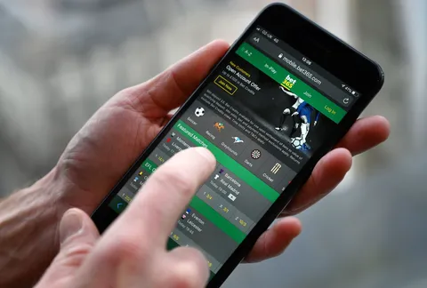 A hand using the bet365 sportsbook on a phone.